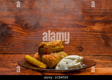 Cabbage rolls with meat, rice and vegetables. Stuffed cabbage leaves with meat. Chou farci, dolma, sarma, golubtsy or golabki. Stock Photo