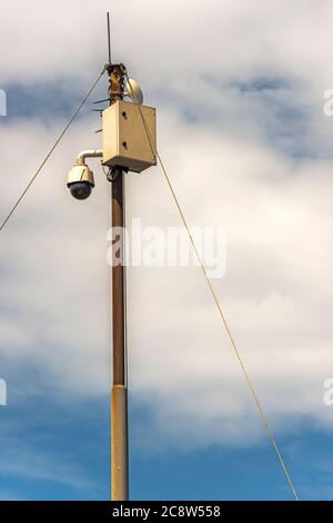 steel pole with power box for electrical supply to a surveillance camera Stock Photo