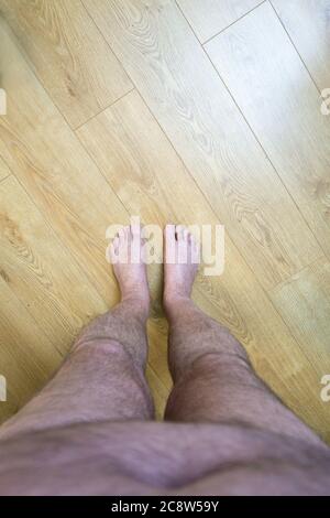 Obese mans point of view looking at his feet Stock Photo