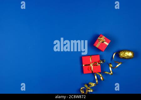 two red gift boxes on blue background. Stock Photo