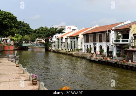 Old buildings sit beside the Malacca River in Malacca's Old Quarter, Malacca, Malaysia Stock Photo