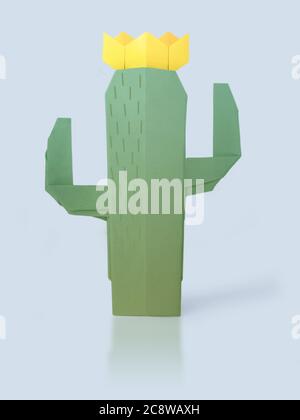 Origami succulent cactus with yellow flowers on a pale blue background Stock Photo