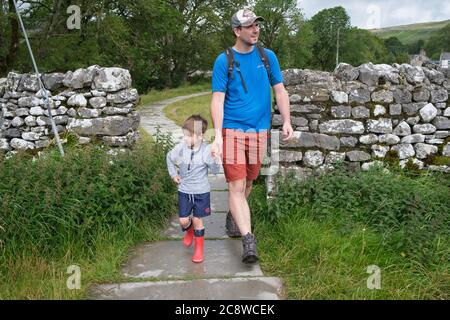 Father and son bonding together in the Yorkshire Dales, UK. Stock Photo