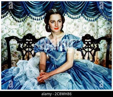Olivia de Havilland (1916-2020) playing Melanie Hamilton in Gone with the Wind (1939) an epic historical romance film adapted from Margaret Mitchell's 1936 novel and directed by Victor Fleming and George Cukor. Olivia de Havilland was one of the leading movie stars during the golden age of Classical Hollywood and appeared in 49 feature films before retiring in 1988. Stock Photo