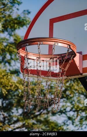 closeup of an outdoors basketball hoop at sunrise Stock Photo