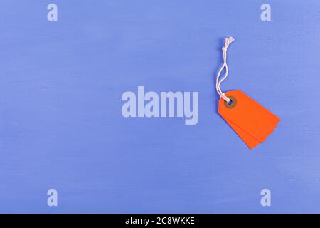 Blank label tag isolated on blue background. Price tag. Sale concept. Stock Photo