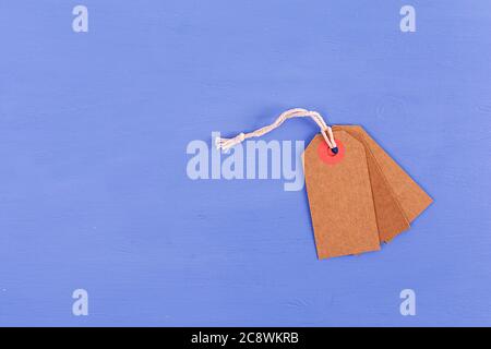 Blank label tag isolated on blue background. Price tag. Sale concept. Stock Photo