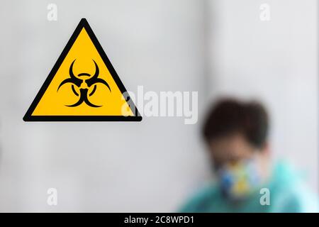 A biohazard warning sign is seen on a window of a laboratory in blood donation station.  The regional blood donation station in Kraków is the most imp Stock Photo