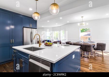 https://l450v.alamy.com/450v/2c8wrk2/a-luxurious-white-and-blue-kitchen-with-gold-hardware-and-white-marbled-granite-counter-tops-looking-towards-the-dining-room-2c8wrk2.jpg