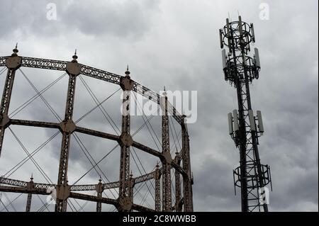 Mobile phone mast & gasometer Stock Photo