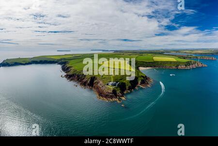 Aerial view of 19th century coastal fort on clifftops surrounded by fields and ocean (Milford Haven, Wales)