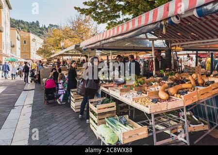 The famous Marche Aux Fleurs Cours Saleya in Place Charles Felix. Fresh fruits and vegetables lie on the historical market stalls- Nice, France Stock Photo