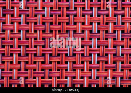 Vivid red basket weave mesh texture background Stock Photo