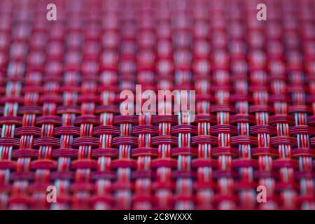 Vivid red basket weave mesh texture background with limited focus Stock Photo