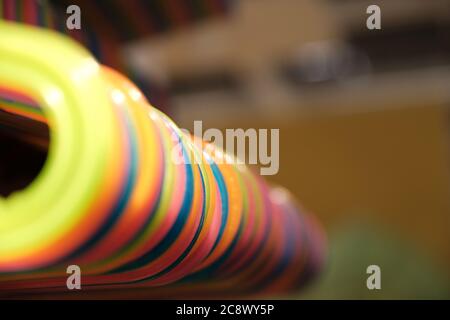 The Colorful , plastic Clothes Hanger. Hangers hang in a row Stock Photo
