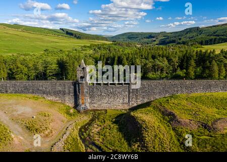 Aerial view of an empty reservoir with old dam wall (Upper Neuadd Reservoir, Brecon Beacons, Wales) Stock Photo