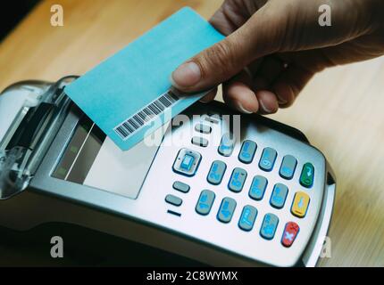 Photo of hand woman paying with credit card with paypass. Stock Photo