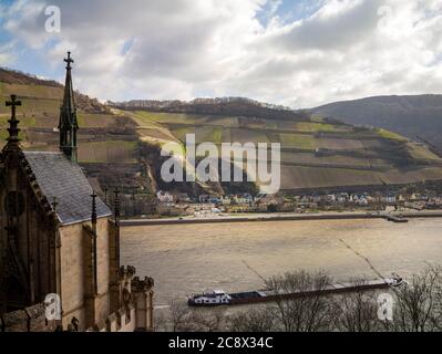 view from the chapel of Rheinstein Castle across the Rhine to Rüdesheim am Rhein, Germany, and vineyards above it. Stock Photo