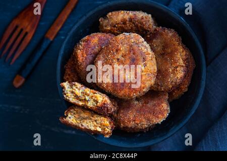Vegetables patties or cutlets on a black plate. Top view. Stock Photo