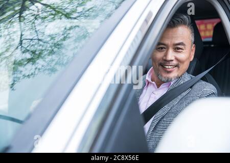 Middle-aged and old man in the car business Stock Photo