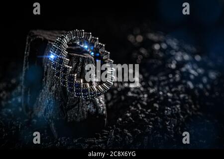 Ring of the jewelry with blue stones on dark background Stock Photo