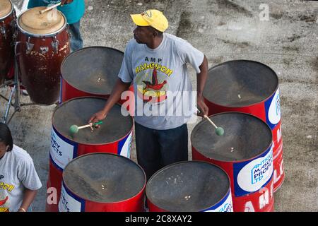 A steel band player on the quayside for passengers on visiting cruise ships at St Johns, Antigua, The Caribbean, West Indies Stock Photo