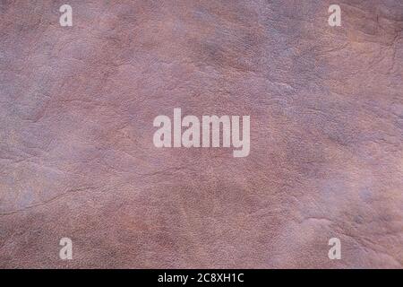 Texture of old smooth red brown leather, handmade and painted. Stock Photo