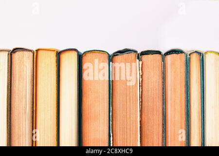 Pile of vintage old hardback books with copy space. Stock Photo