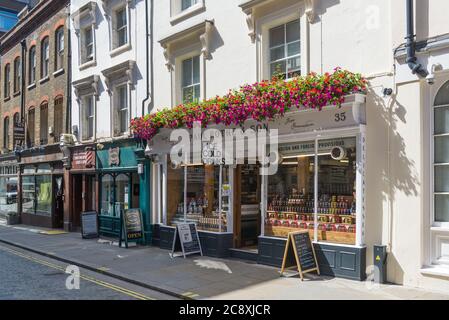 Paul Rothe & Son delicatessen standing prominently in a row of small shops in Marylebone Lane, London, England, UK Stock Photo