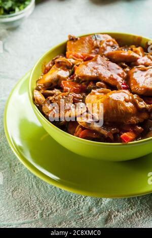 Fresh turkey ragout with mushrooms in creamy sauce Stock Photo