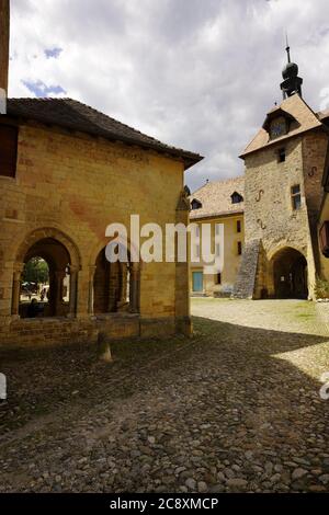 Impressive  Clock Tower of the Romanesque church of Saint-Pierre-et-Saint-Paul in Romainmotier, canton of Vaud, Switzerland. Stock Photo