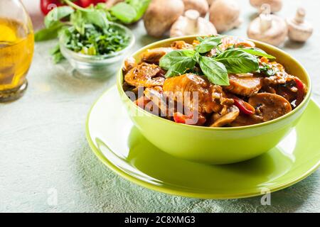 Fresh turkey ragout with mushrooms in creamy sauce Stock Photo