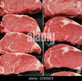 fresh raw beef rib eye steak for sale in grocery store Stock Photo