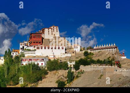 Thiksay monastery with view of Himalayan mountians and blue sky with white clouds  in background,Ladakh,Jammu and Kashmir, India Stock Photo