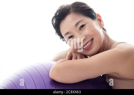 Middle-aged women on yoga ball Stock Photo