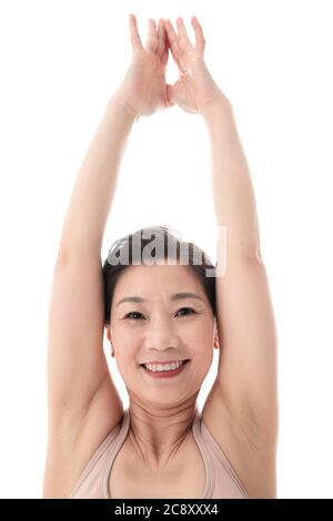 Middle-aged and old women doing yoga Stock Photo