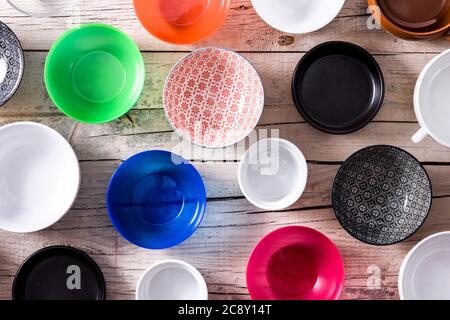 Set of different empty bowls on wooden background Stock Photo
