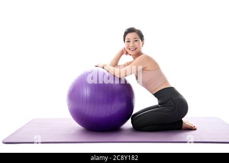 Middle-aged women and yoga ball Stock Photo