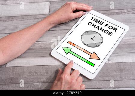 Time for change concept shown on a tablet used by a woman Stock Photo