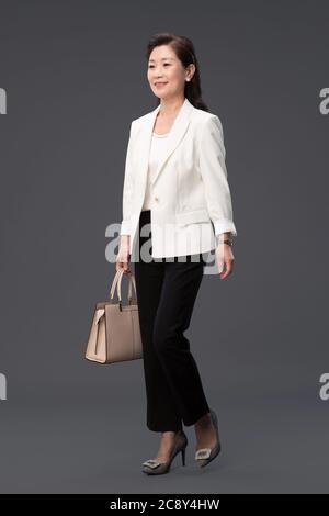 Carrying bag business lady to go to work Stock Photo