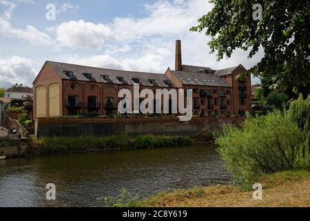 Old mill/factory that has been converted into modern flats or appartments. Set overlooking the River Severn in Shrewsbury. Stock Photo