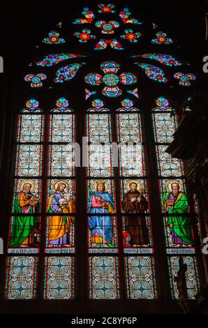 PRAGUE - MARCH 10, 2020: Interior of St. Vitus Cathedral in Prague. Stained glass window depicting Christian saints Stock Photo