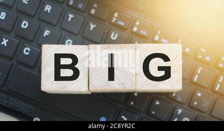 Wooden cubes with word BIG on computer keyboard. Big data business concept Stock Photo