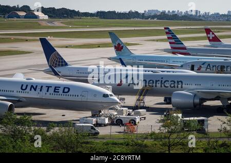 Wide view of the remote aircraft parking area of Sao Paulo/Guarulhos Intl. Airport, where planes awaits there while serviced by ground handling. Stock Photo