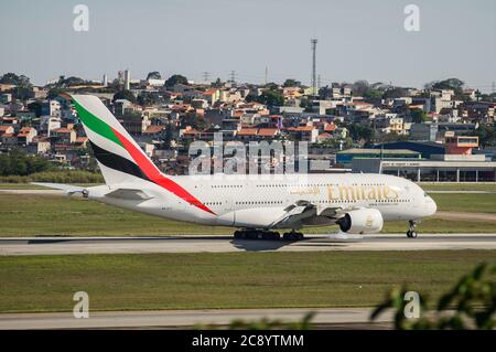 The Emirates Airlines Airbus A380-800 (Wide-body aircraft - Reg. A6-EUT) landed on runway 27R of Sao Paulo/Guarulhos International Airport. Stock Photo