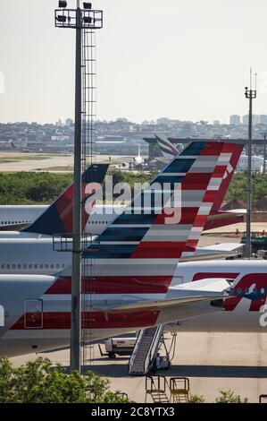 Close view of a vertical stabilizer from an American Airlines Boeing 777 while parked on the remote area of Sao Paulo/Guaruhos Intl. Airport. Stock Photo