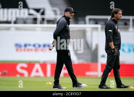 Newcastle, UK. 26th July, 2020. Liverpool manager Jurgen Klopp & Peter Krawietz of Liverpool, Second Assistant Coach during the Premier League match between Newcastle United and Liverpool Football Stadiums around remain empty due to the Covid-19 Pandemic as Government social distancing laws prohibit supporters inside venues resulting in all fixtures being played behind closed doors until further notice at St. James's Park, Newcastle, England on 26 July 2020. Photo by Andy Rowland. Credit: PRiME Media Images/Ģ����ý Live News Stock Photo