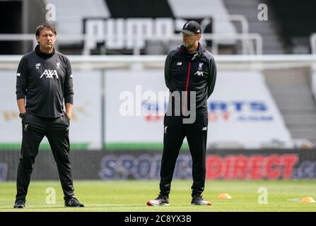 Newcastle, UK. 26th July, 2020. Liverpool manager Jurgen Klopp & Peter Krawietz of Liverpool, Second Assistant Coach during the Premier League match between Newcastle United and Liverpool Football Stadiums around remain empty due to the Covid-19 Pandemic as Government social distancing laws prohibit supporters inside venues resulting in all fixtures being played behind closed doors until further notice at St. James's Park, Newcastle, England on 26 July 2020. Photo by Andy Rowland. Credit: PRiME Media Images/Ģ����ý Live News Stock Photo