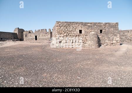 The interior courtyard of the eastern desert castle of Qasr al-Azraq near the town of Azraq, in the Badia region of the Hashemite Kingdom of Jordan. Stock Photo