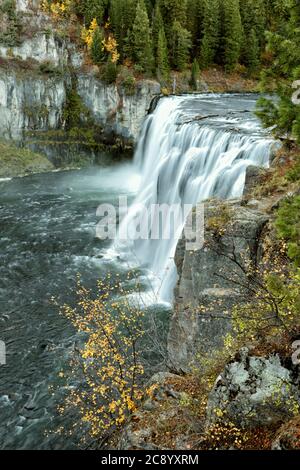 Water flows over Upper Mesa Falls in autumn, on the Henry's fork of the Snake River in Eastern Idaho. Stock Photo